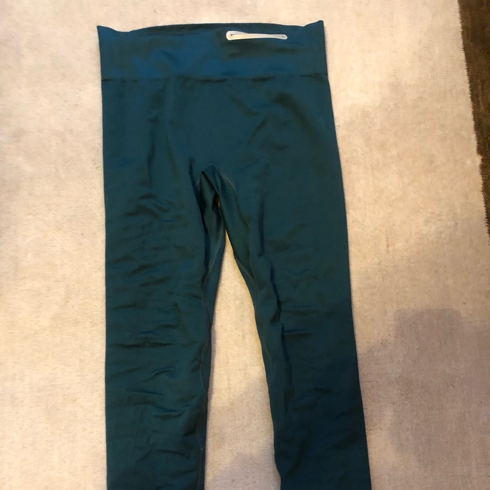 Under Armour green shaping leggings with a pocket